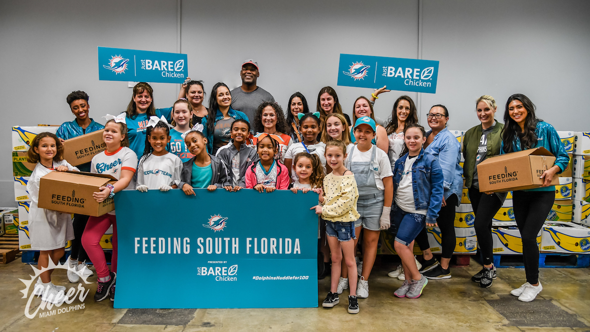 Dolphins Cheerleaders and Junior Cheerleaders in a #DolphinsHuddleFor100  Project - Feeding South Florida®