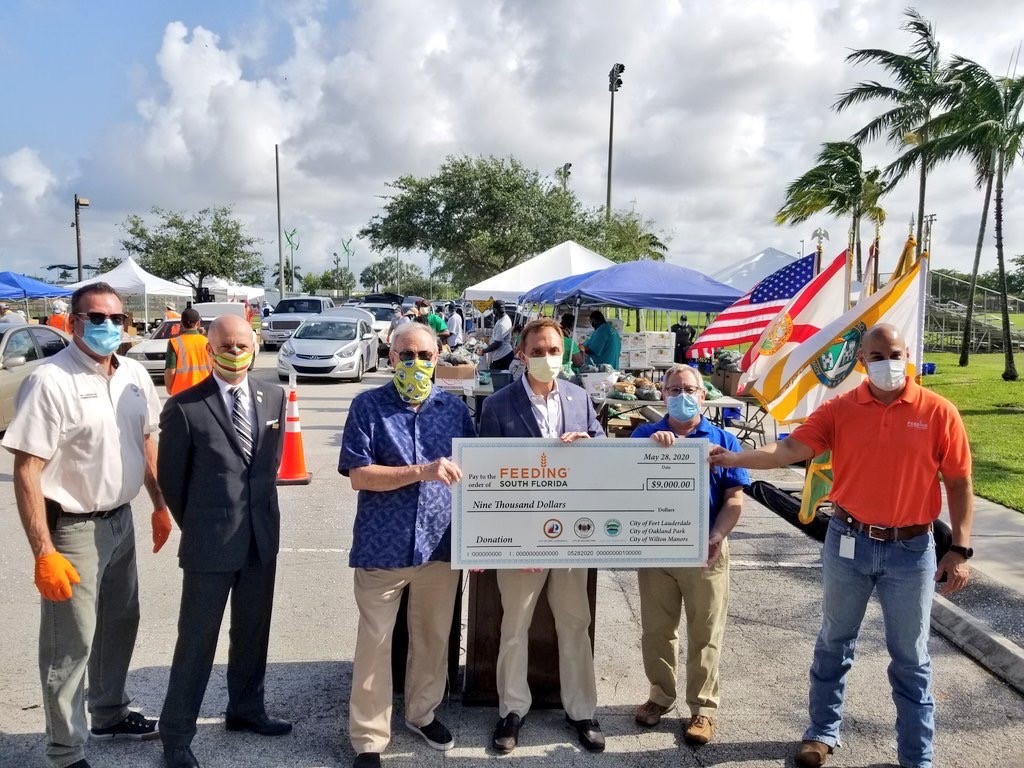 The Cities of Fort Lauderdale, Oakland Park, and Wilton Manors presented a joint check for $9,000 to Feeding South Florida.