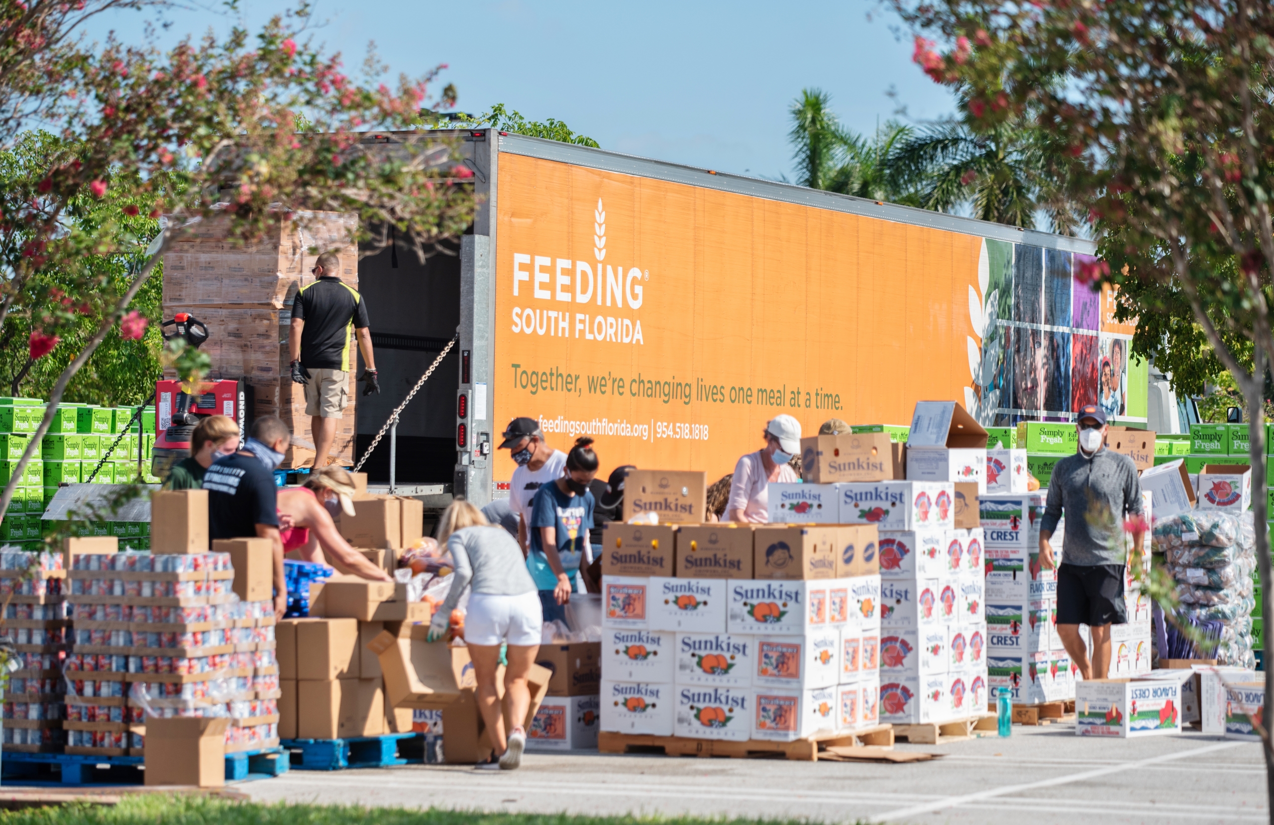 Feeding South Florida Truck Offloaded with Food at Drive-Thru Distribution in 2020.