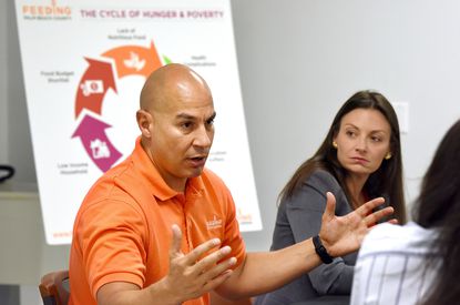 Paco Velez and Nikki Fried at Feeding South Florida's Boynton Beach facility in 2019.