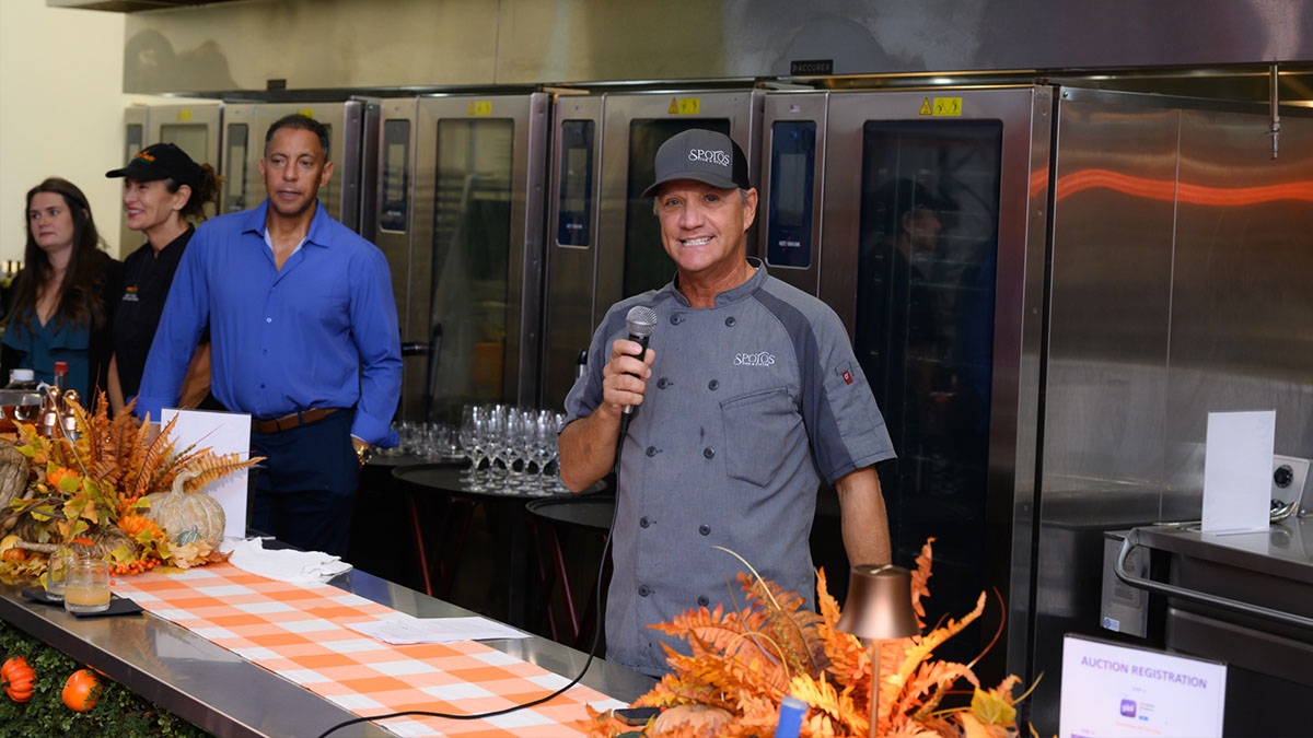 Image of chef presenting the meal.